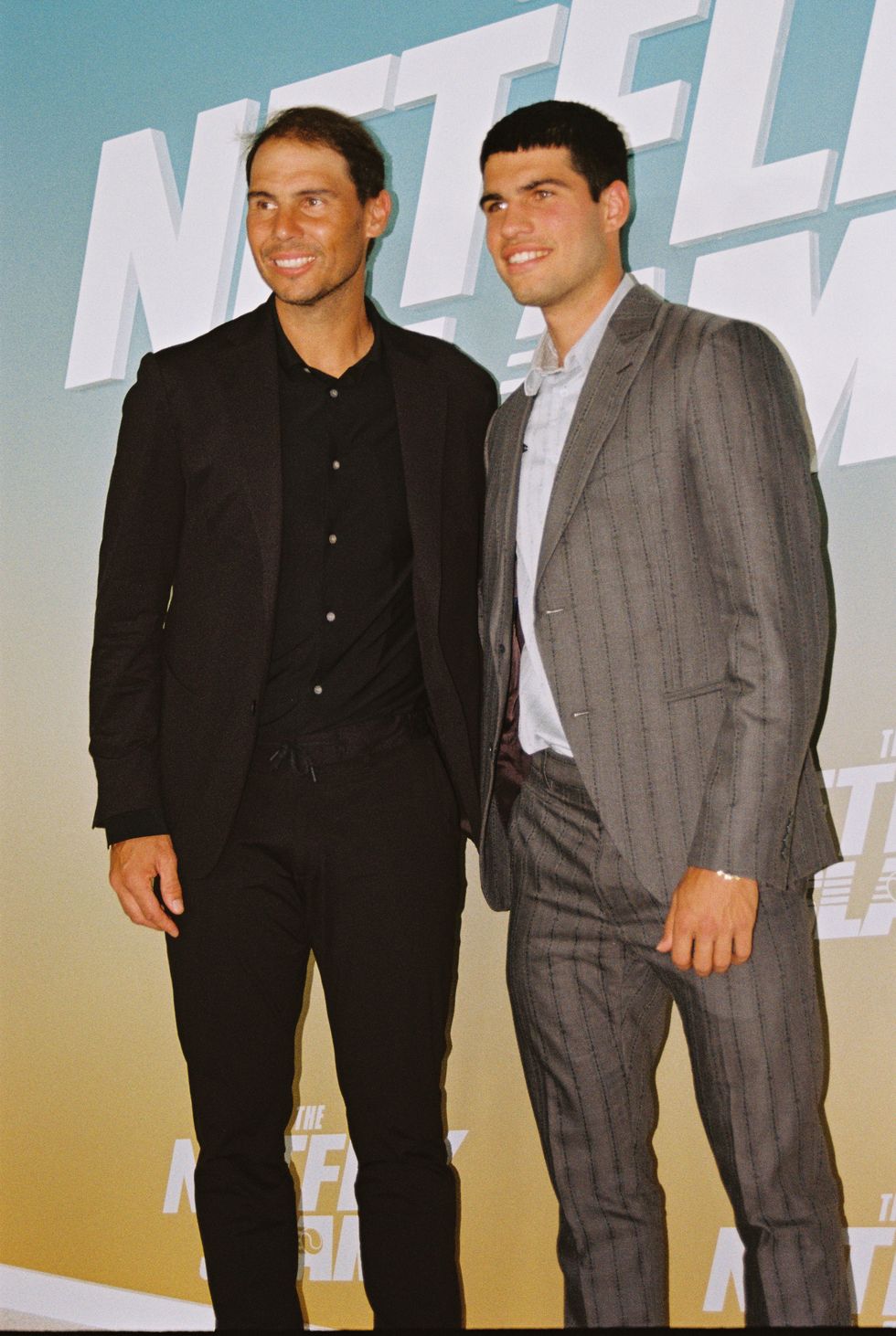 two men standing next to each other