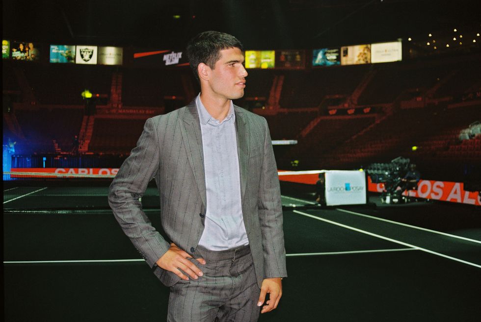 a man standing on a tennis court