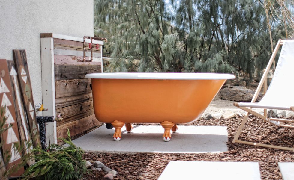 orange bathtub outside