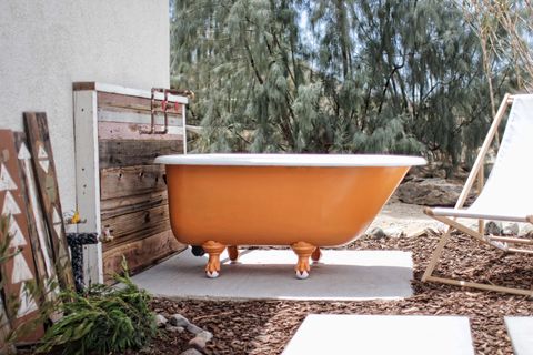 orange bathtub outside