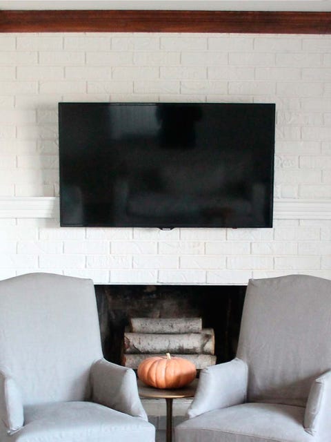 Room, Living room, Furniture, Fireplace, Wall, Hearth, Interior design, Couch, Table, Rectangle, 