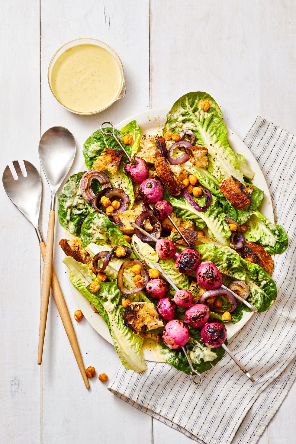 caesar salad with grilled radishes on skewers