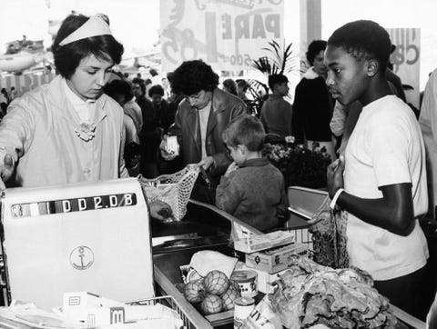 vintage photos of grocery store   customer checking out at cash register