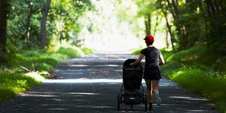 parent running with stroller