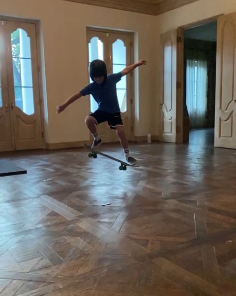 caitlin wilson's son rides a skateboard in the empty house
