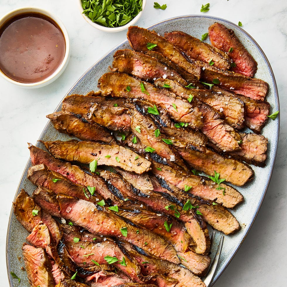 steak sliced and topped with cajun butter and herbs