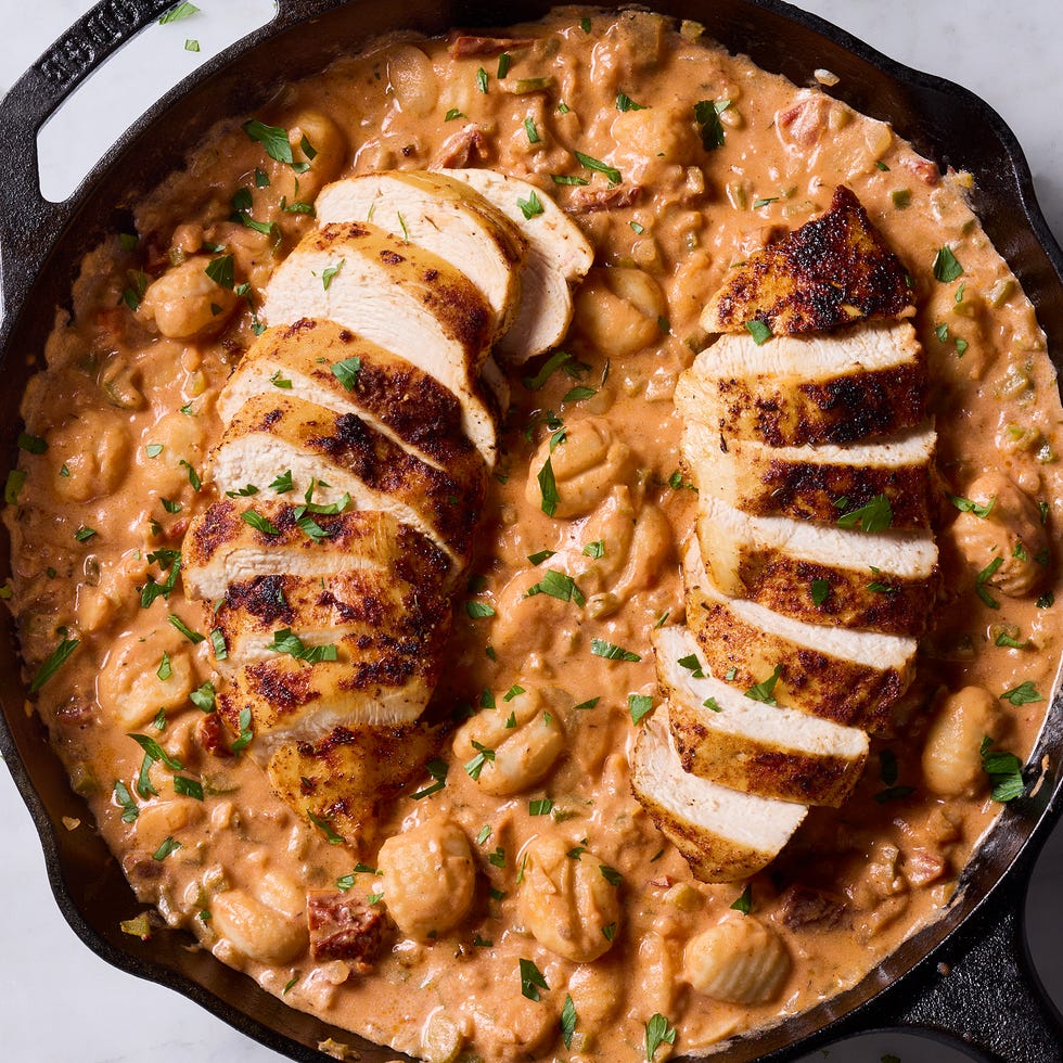 gnocchi in a tomato based sauce with sliced spiced chicken