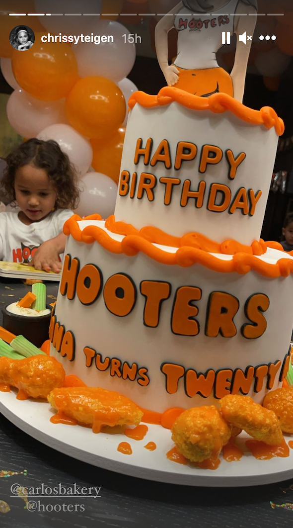 hooters cake with wings dripping in sauce