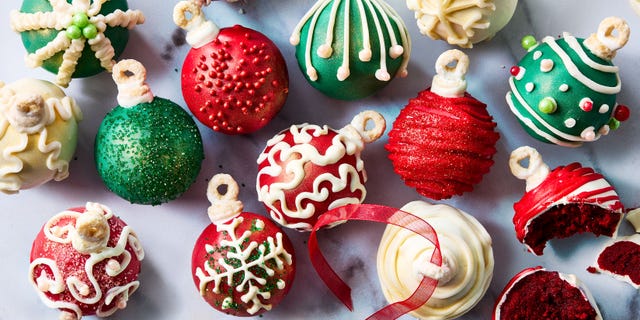 cake balls covered in icing and shaped like ornaments