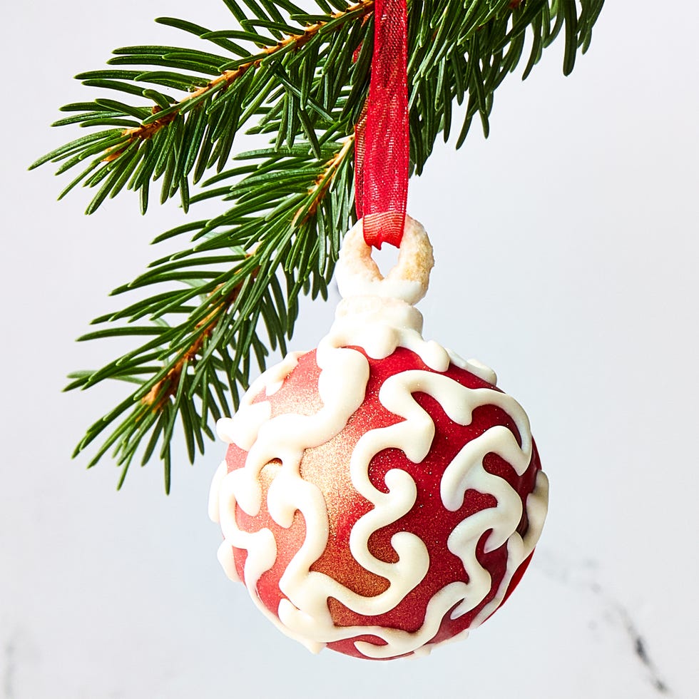 cake balls covered in icing and shaped like ornaments