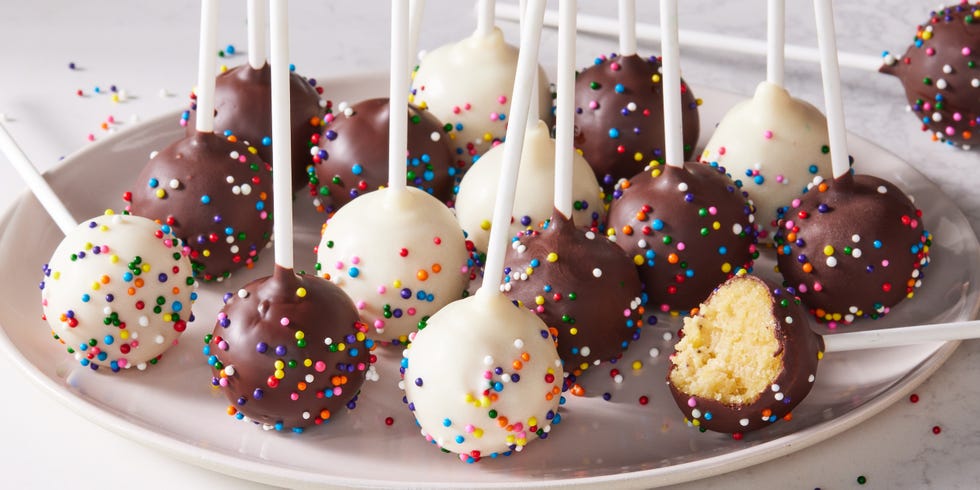 cake pops covered in chocolate and white cocolate icing and sprinkles