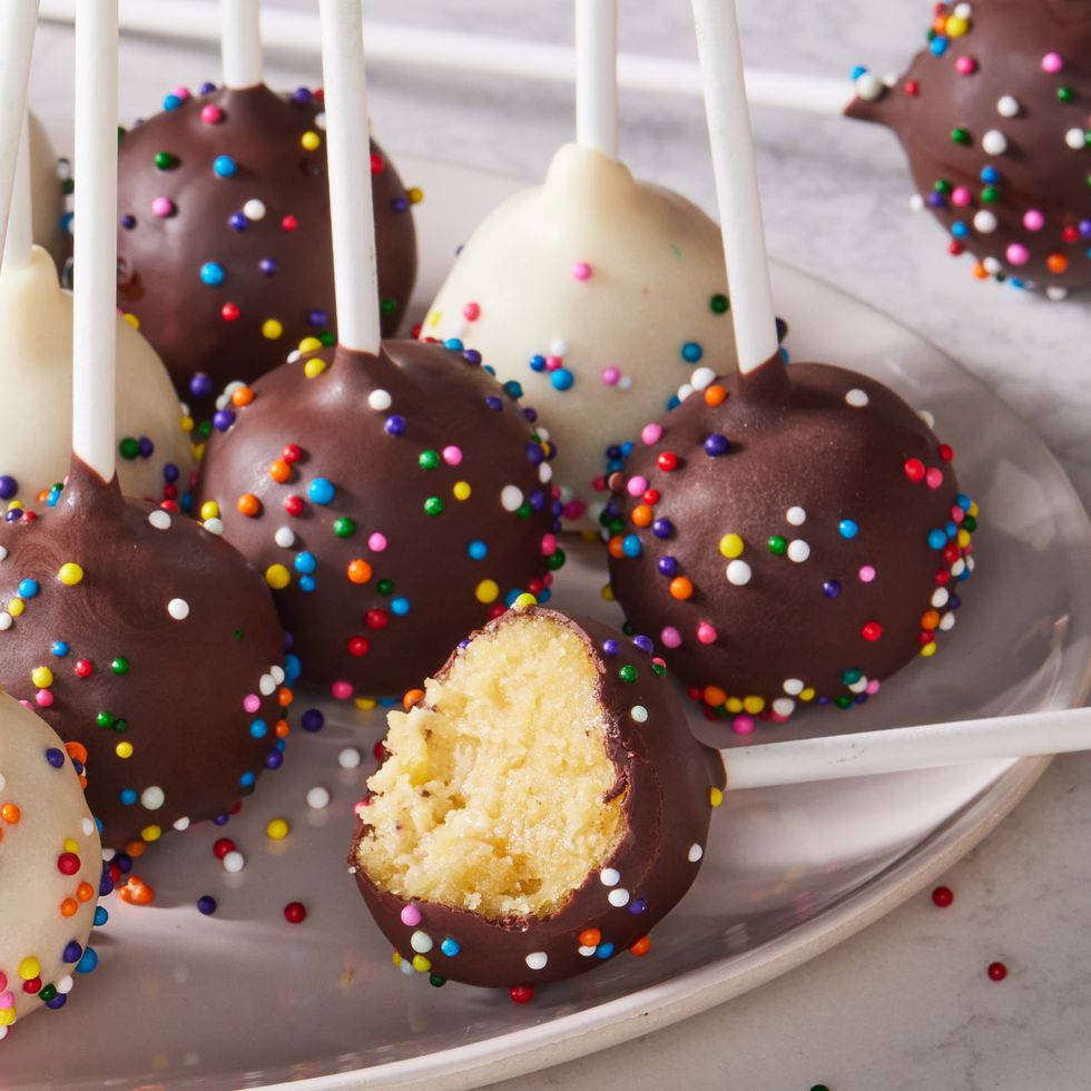 cake pops covered in chocolate and white cocolate icing and sprinkles
