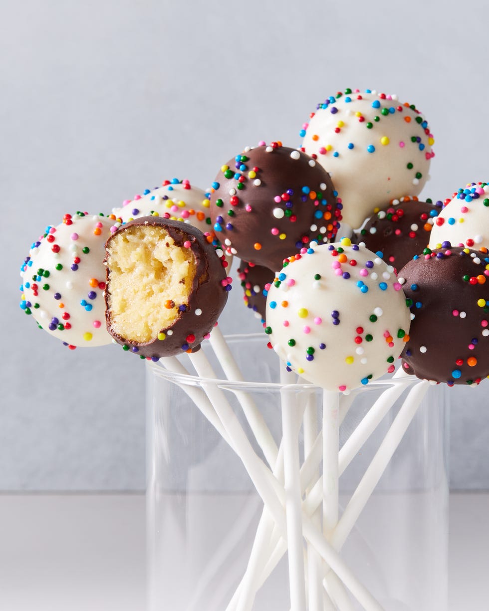 cake pops covered in chocolate and white cocolate icing and sprinkles