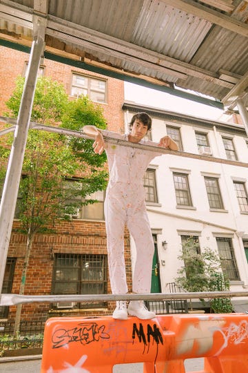 a person standing on a railing