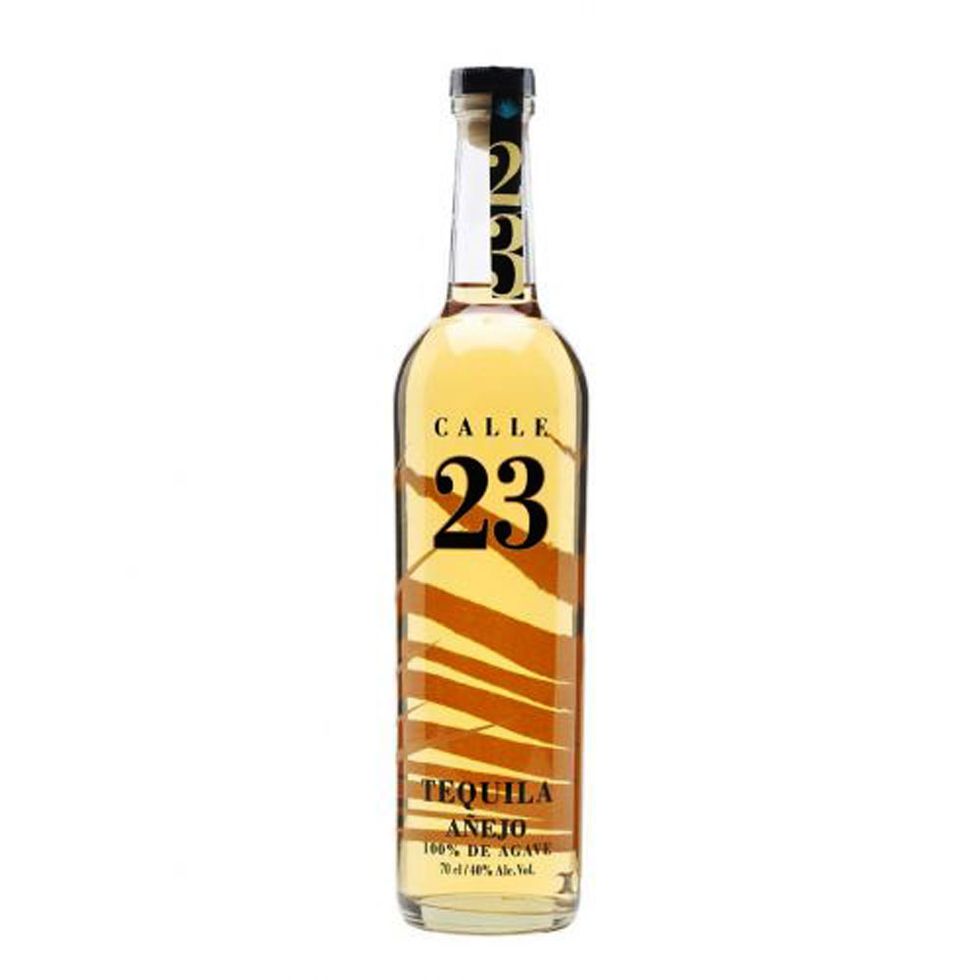 bottle of calle 23 anejo tequila