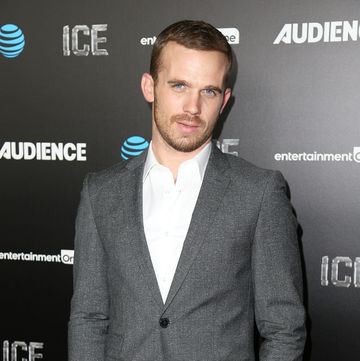 actor cam gigandet poses at an event wearing a grey suit in november 2016