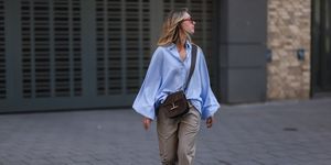 hamburg, germany august 15 lisa späht is seen wearing beige sosue pants, a blue blouse , vintage shades, vintage brown shoes, tom ford brown leather bag on august 15, 2022 in hamburg, germany photo by jeremy moellergetty images