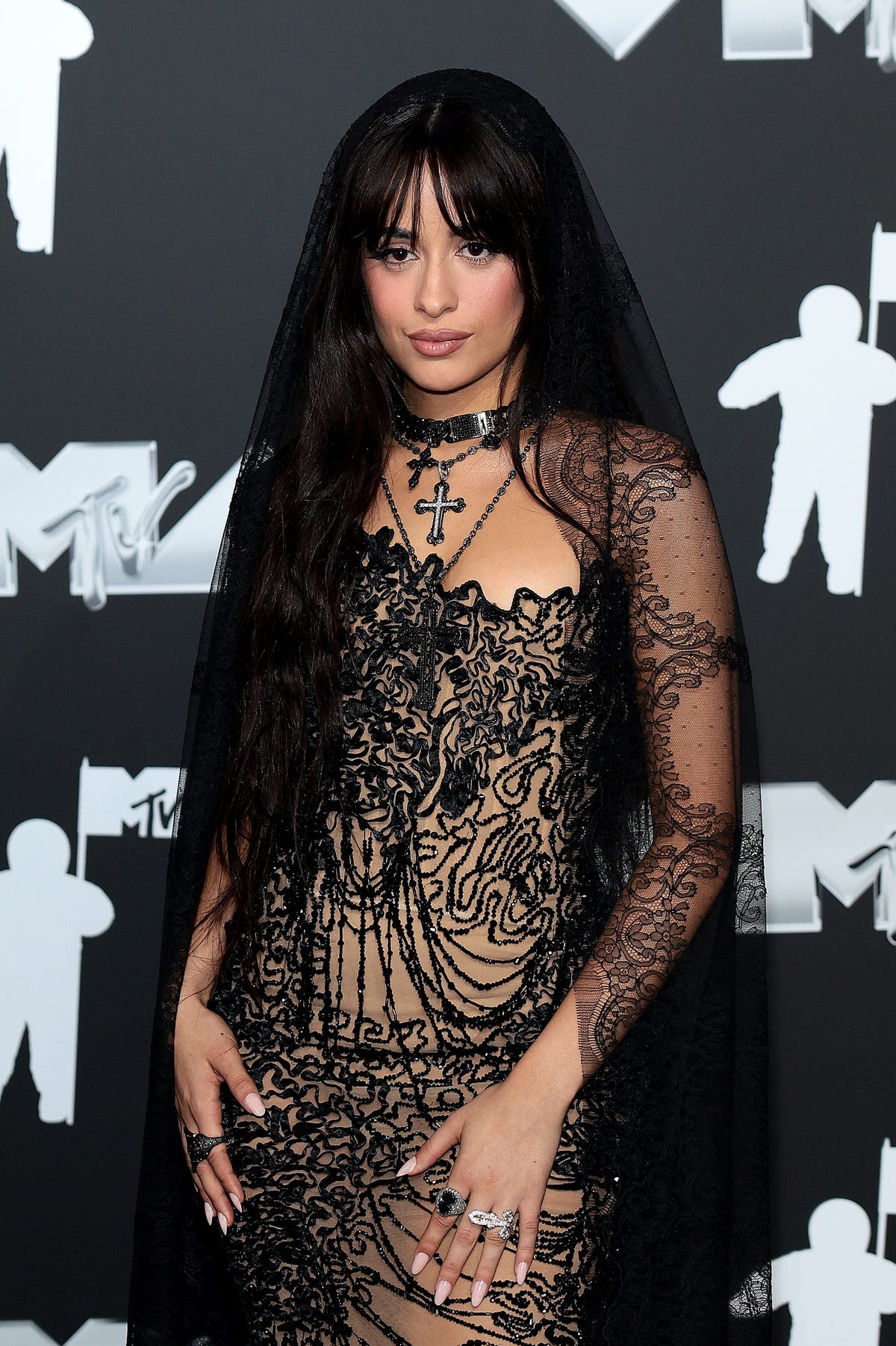 Camila Cabello wears a black transparent dress and a veil at the MTV VMAs 2024