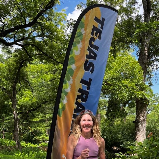 camille herron holds the winners trophy at the texas trail festival marathon