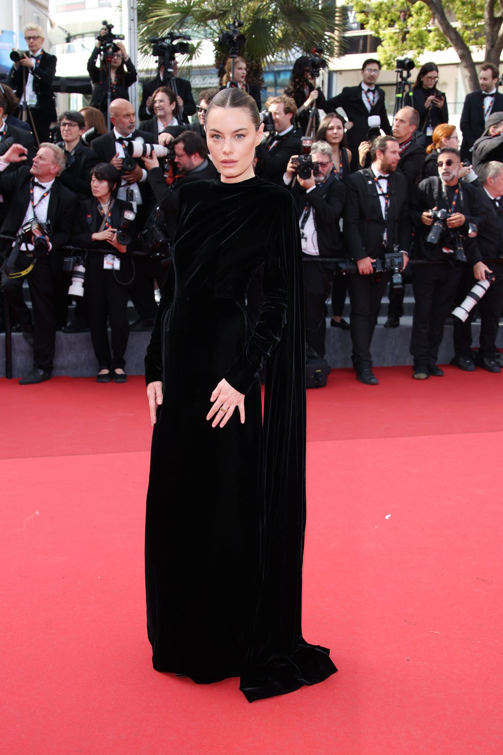 Camille Rowe on the red carpet at the 77th Cannes Film Festival