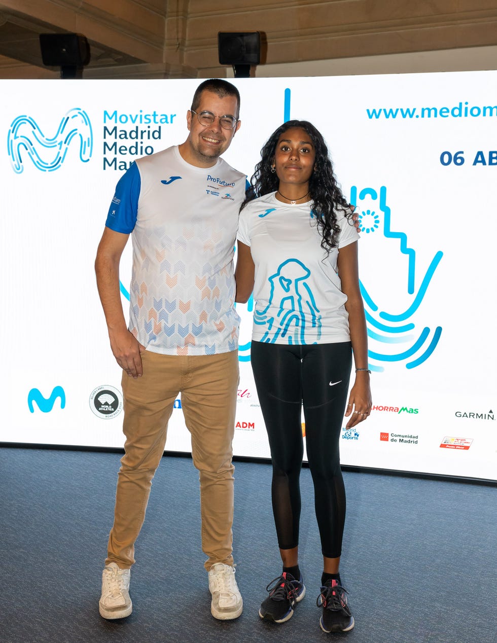 promotional event for a running event featuring two people in sporty attire