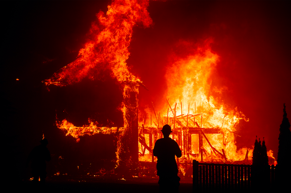 a house burns in paradise, california, in the camp fire of 2018