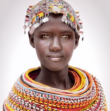 Neck, Yellow, Headgear, Fashion accessory, Tribe, Tradition, Art, 