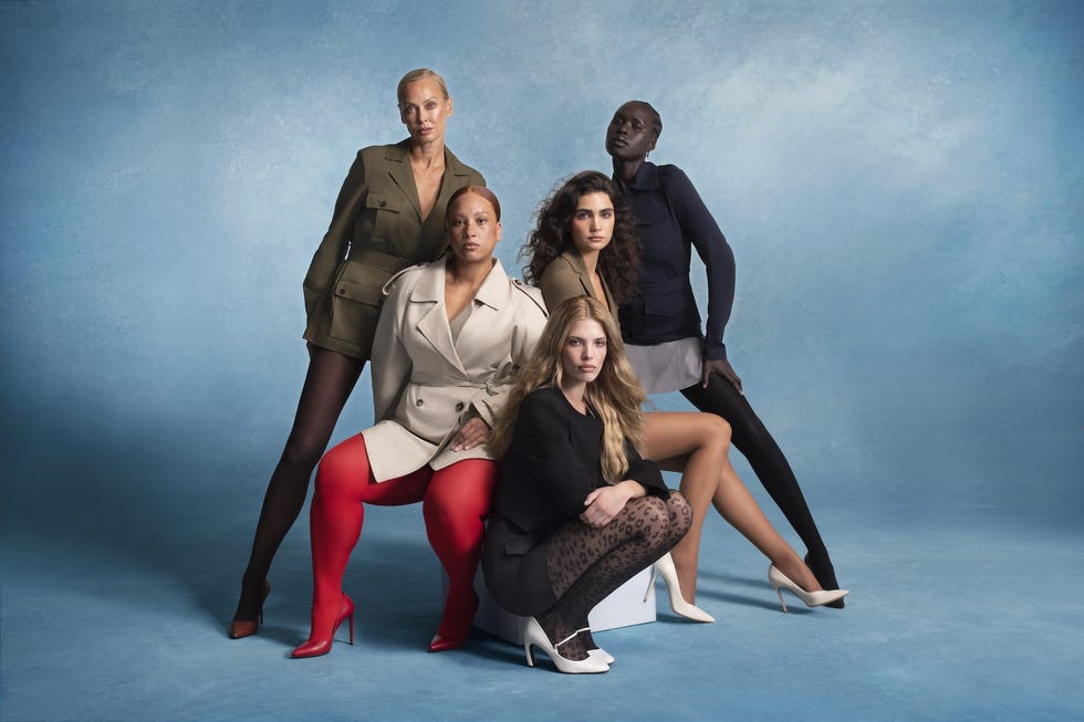 group of models posing in stylish outfits with varied legwear against a blue background