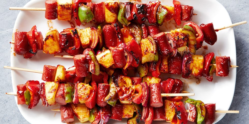 grilled skewers with sliced hot dogs, pineapple, red bell peppers basted with a bbq sauce