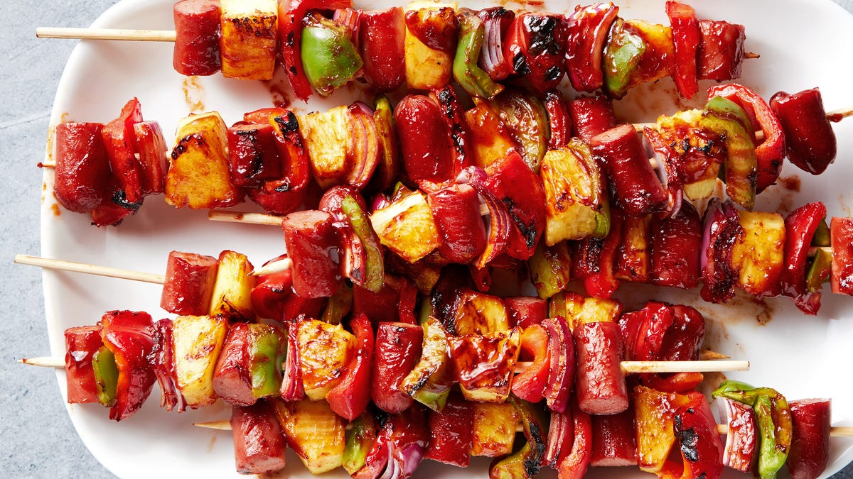 Video player poster image preview for Ditch The Ketchup & Mustard—Make These Campfire Hot Dog Skewers Instead