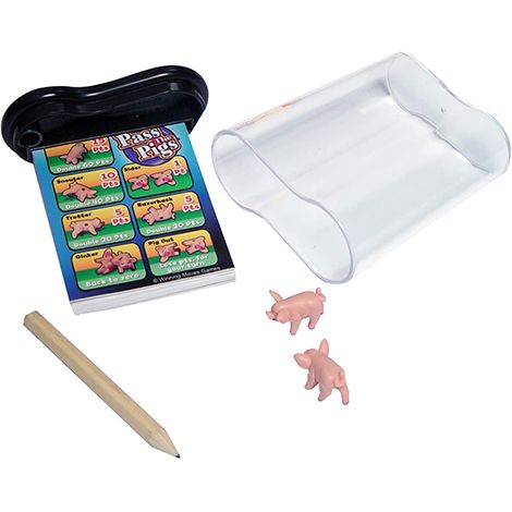 all of the pieces necessary to play pass the pigs, a good housekeeping pick for best camping activity, set against a white background