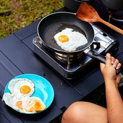 cooking eggs on camping kitchen