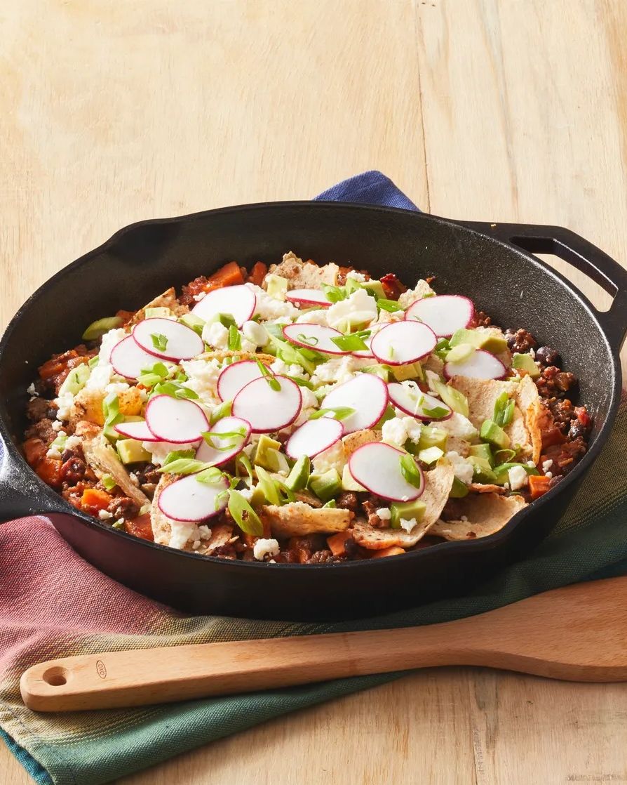 https://hips.hearstapps.com/hmg-prod/images/camping-recipes-beef-taco-skillet-1652733099.jpeg?crop=0.912xw:0.917xh;0.0425xw,0.0301xh&resize=980:*