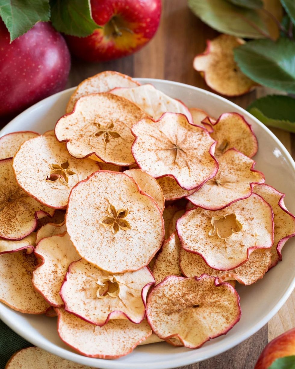 baked apple chips in a large white bowl