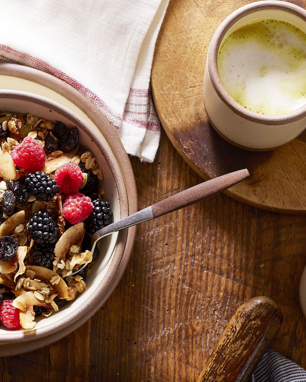 seeded granola served over yogurt with berries