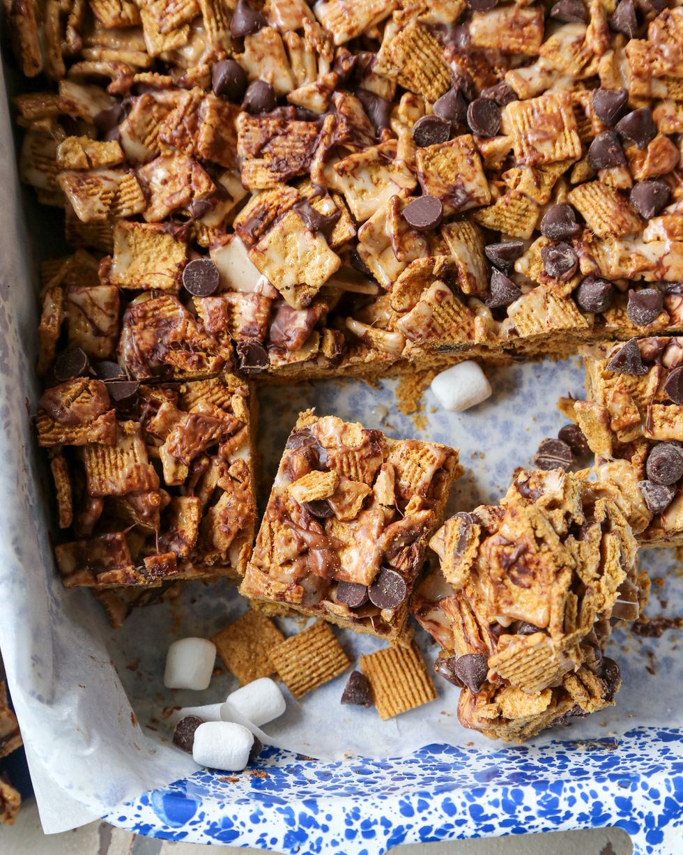 smores graham krispie treats cut into squares in a rectangle parchment lined pan