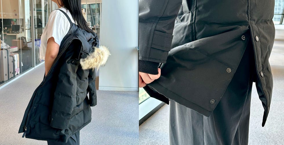 someone modeling the straps inside of the canada goose jacket and the rear vent flaps