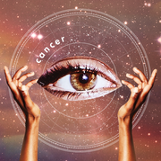 two hands hold up a giant eye in the middle of a starry sky , with the word "cancer" above it
