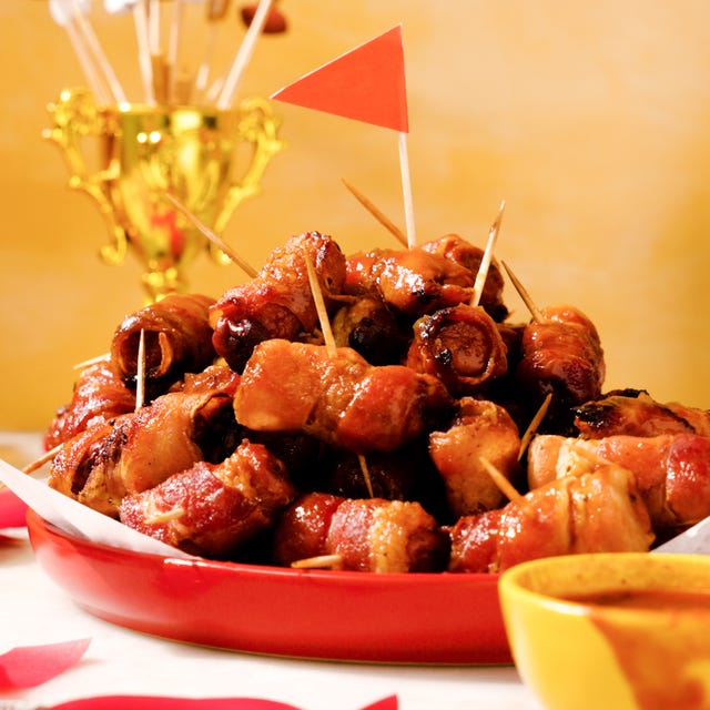 Candied Bacon Mahomies plate of baconwrapped chicken bites with toothpicks and dipping sauce