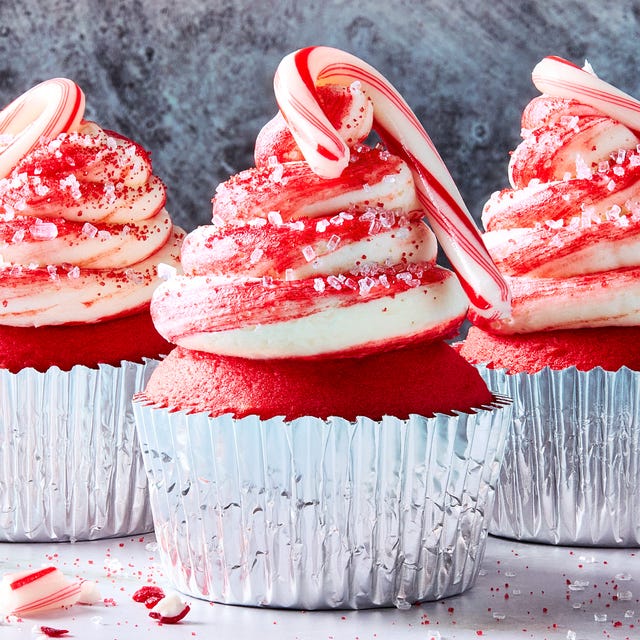 Candy Cane Cupcakes red cupcakes with icing topped with mini candy canes