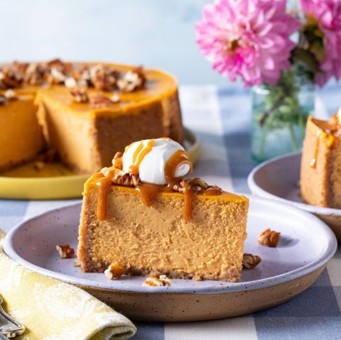 pumpkin cheesecake slice with caramel and whipped cream