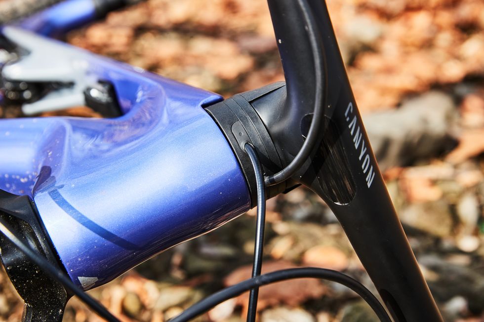 a close up of a bicycle handlebar with internal headset routing