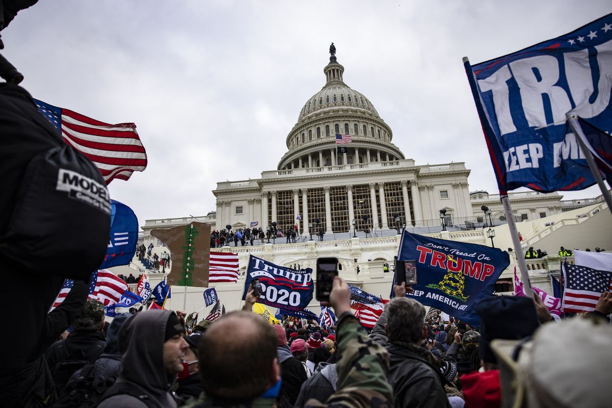 washington, dc   january 06 pro trump supporters storm the us capitol following a rally with president donald trump on january 6, 2021 in washington, dc trump supporters gathered in the nation's capital today to protest the ratification of president elect joe biden's electoral college victory over president trump in the 2020 election photo by samuel corumgetty images