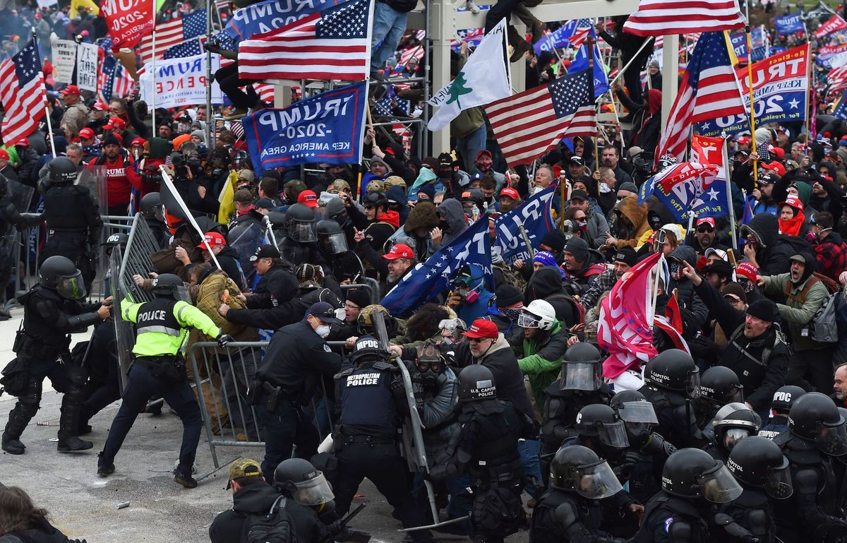 topshot   trump supporters clash with police and security forces as they push barricades to storm the us capitol in washington dc on january 6, 2021   demonstrators breeched security and entered the capitol as congress debated the a 2020 presidential election electoral vote certification photo by roberto schmidt  afp photo by roberto schmidtafp via getty images