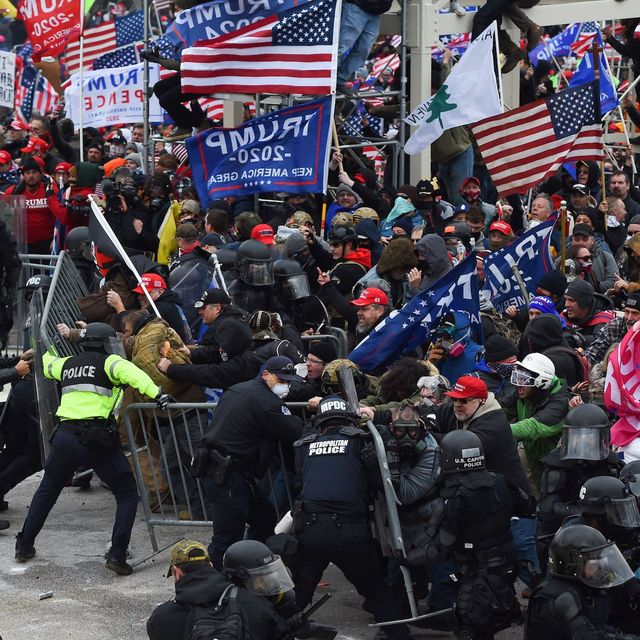 topshot   trump supporters clash with police and security forces as they push barricades to storm the us capitol in washington dc on january 6, 2021   demonstrators breeched security and entered the capitol as congress debated the a 2020 presidential election electoral vote certification photo by roberto schmidt  afp photo by roberto schmidtafp via getty images