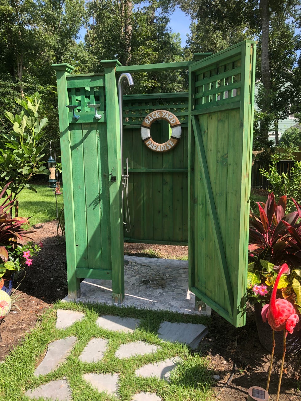 green wood outdoor shower enclosure