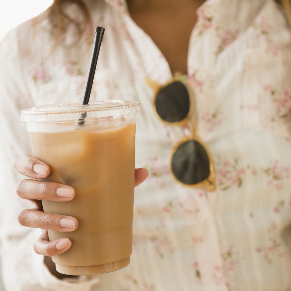 Cape Verdean woman drinking iced coffee