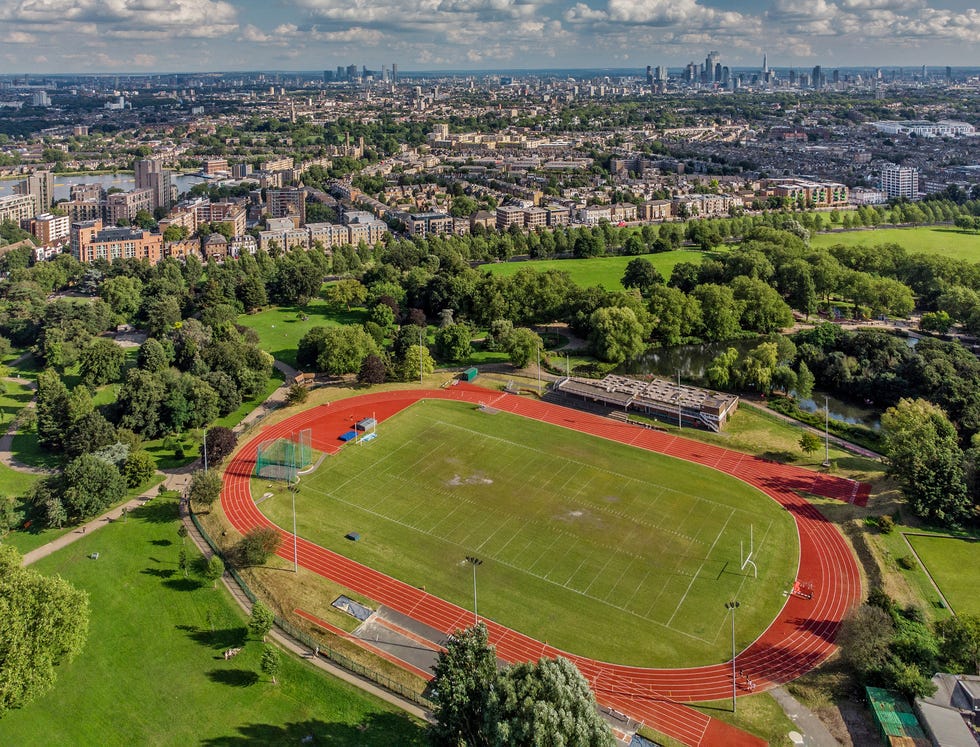 aerial view over finsbury park running track and the city