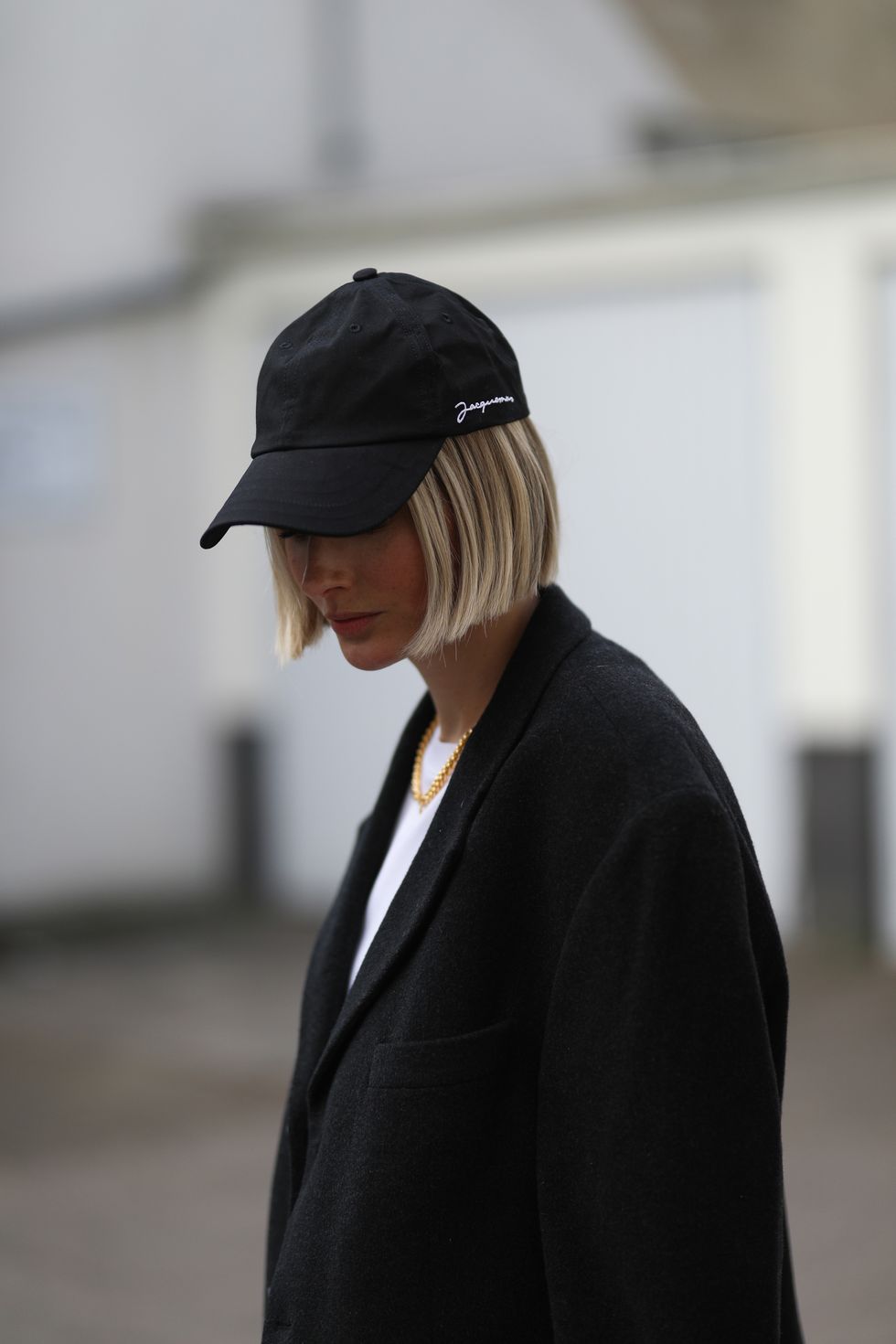 dusseldorf, germany   february 27 kathrin bommann wearing vival white shirt, vintage black blazer and jacquemus black cap on february 27, 2021 in dusseldorf, germany photo by jeremy moellergetty images