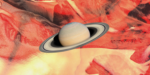 the planet saturn over a swirly red and yellow background